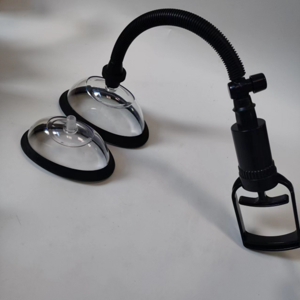 Black two-cup vulva pump set assembled with hose and pump