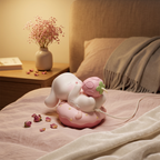 kawaii bunny vibrator displayed on bedside satin with cake base