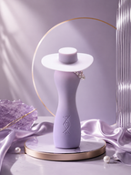 Stylish female torso vibrator with built-in lubrication showcased elegantly on a reflective surface.