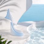 Mermaid Flapping Vibrator with Tail design on a marble surface near water for sensual pleasure.
