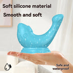 Blue silicone adult wellness toy shaped like a whale, waterproof and soft, shown on a hand.