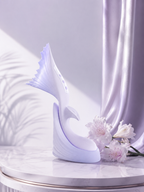 Mermaid Flapping Vibrator with Tail Percussion displayed elegantly with flowers and fabric backdrop.