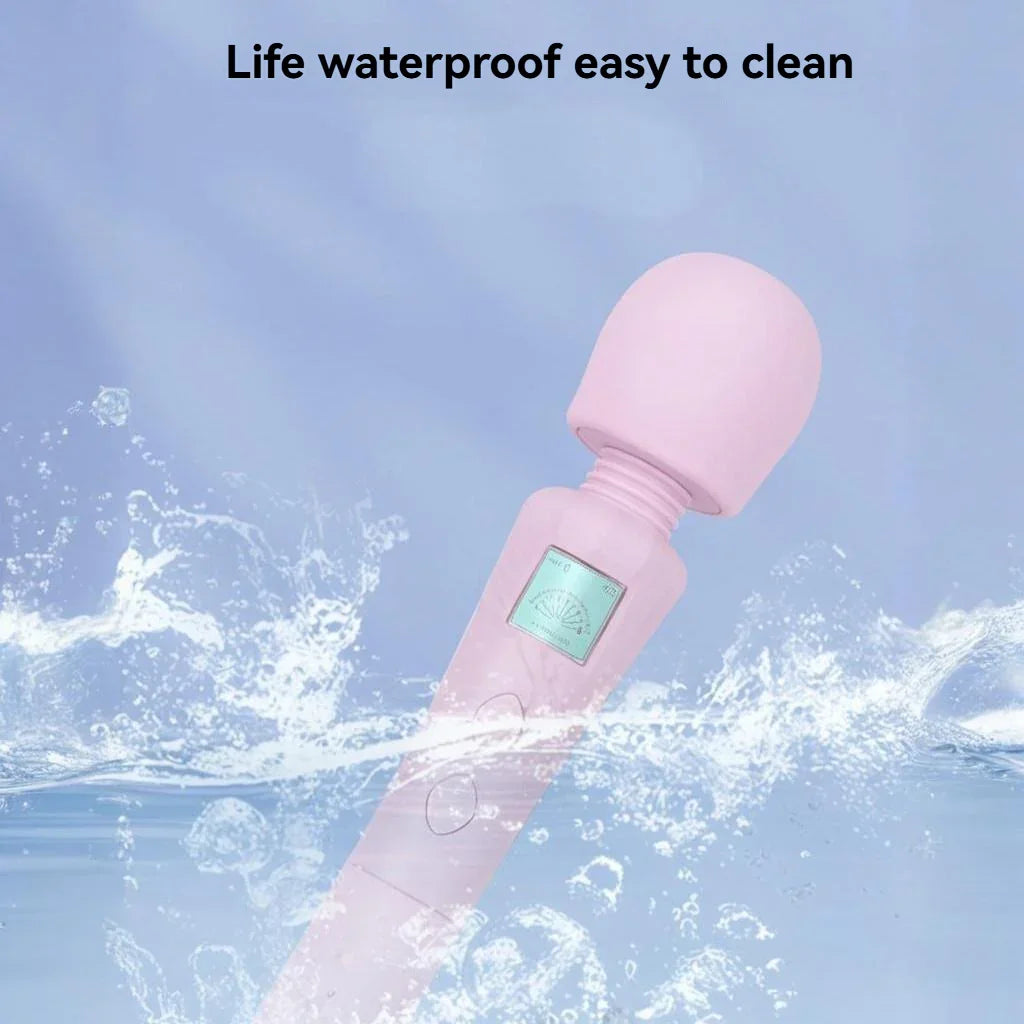 Pink waterproof personal massager splashing in water, featuring simple control buttons.