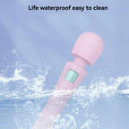 Pink waterproof personal massager splashing in water, featuring simple control buttons.