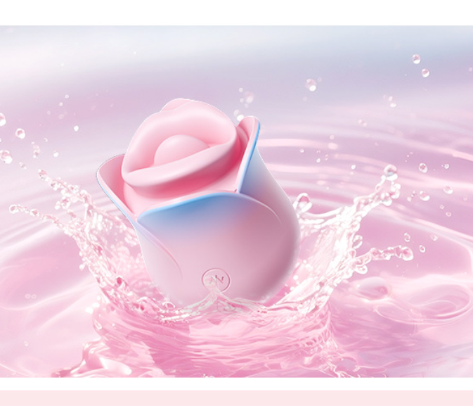 Pink Blue Rose Heated Tongue Clit Vibrator surrounded by splashes of water.