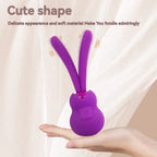 Purple silicone dual-prong personal massager with soft, flexible tips resting on a hand.