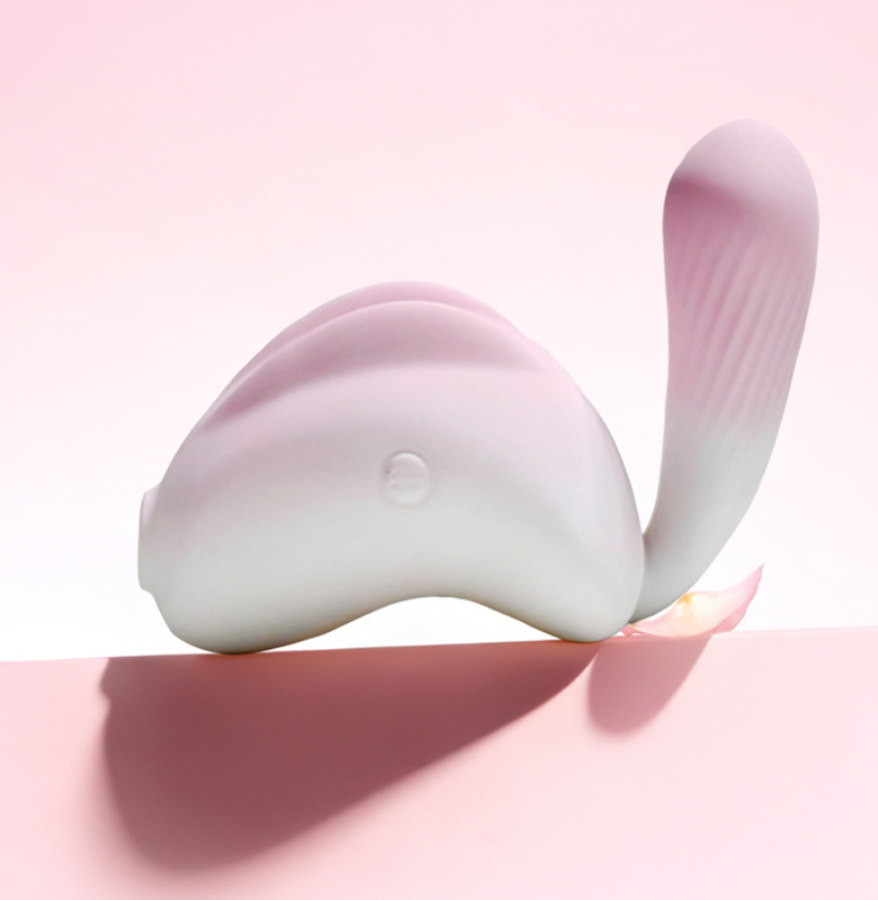 Pink Bunny 180 Rotating Tail Sucking Vibrator showcasing its unique design and features against a soft pink background.