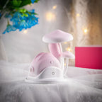 Pink Bunny 180 Rotating Tail Sucking Vibrator on a soft background with flowers and decorative elements.