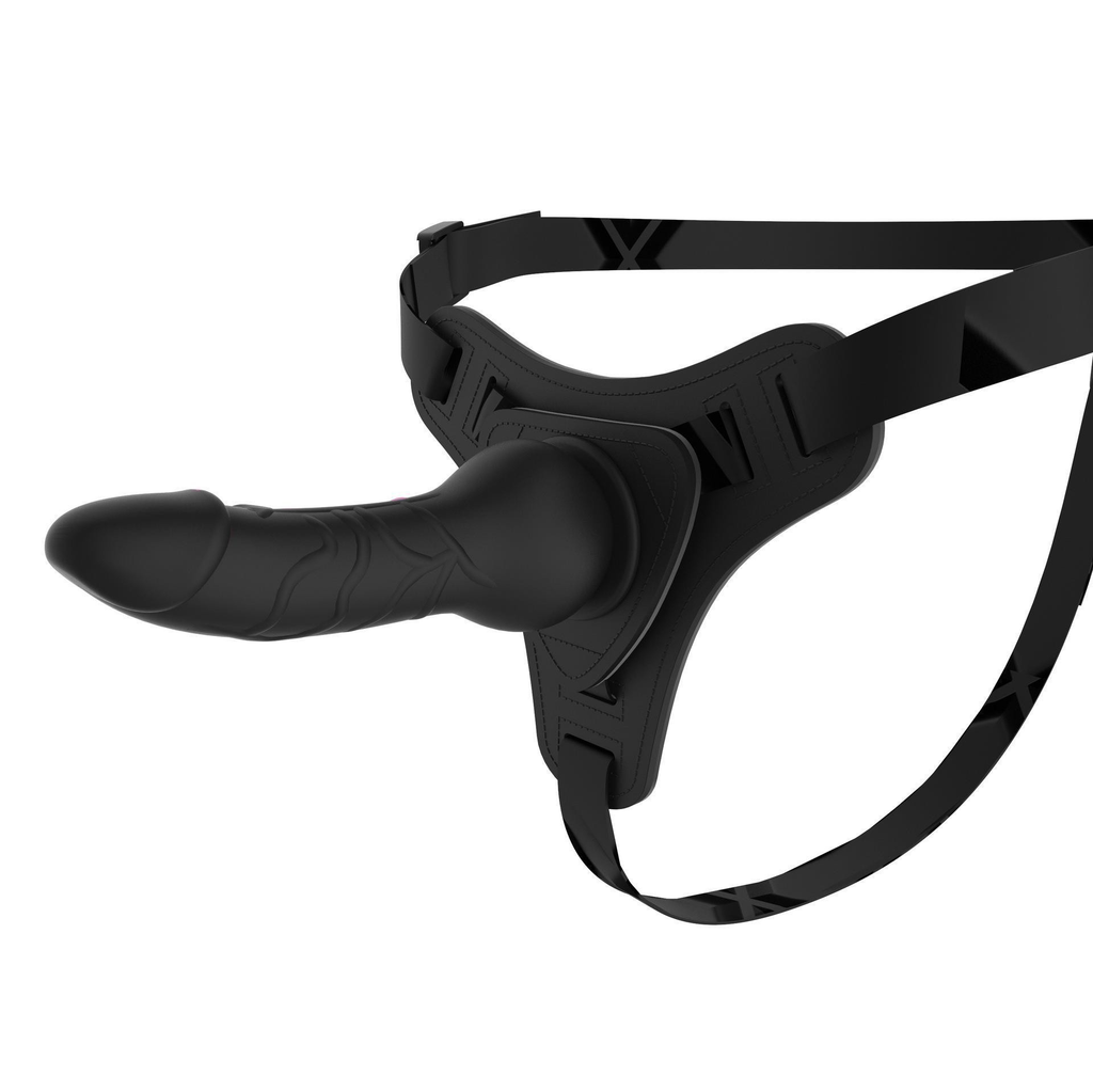 Black strap-on harness, close-up of textured front panel and hardware