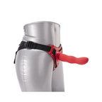 Side view showing the red harness front panel and black adjustable waist strap