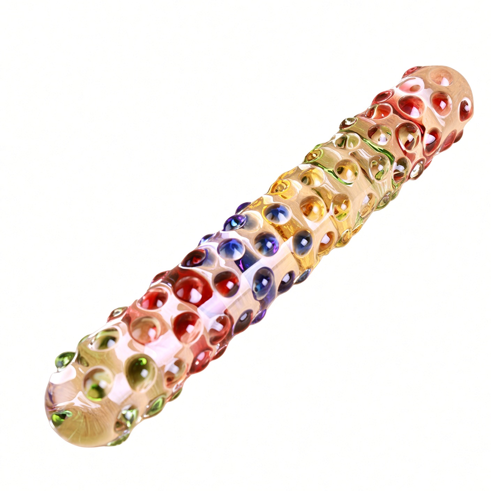 Angled view of clear multicolor glass dildo showing rounded textured bumps
