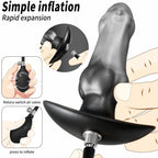 Silver and black inflatable silicone anal plug with handheld pump and air hose
