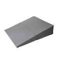 Gray folding sex positioning wedge pillow shown in its fully opened incline configuration