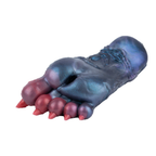 Dragon claw silicone masturbator in blue-purple tones with red sculpted talons on clean white background