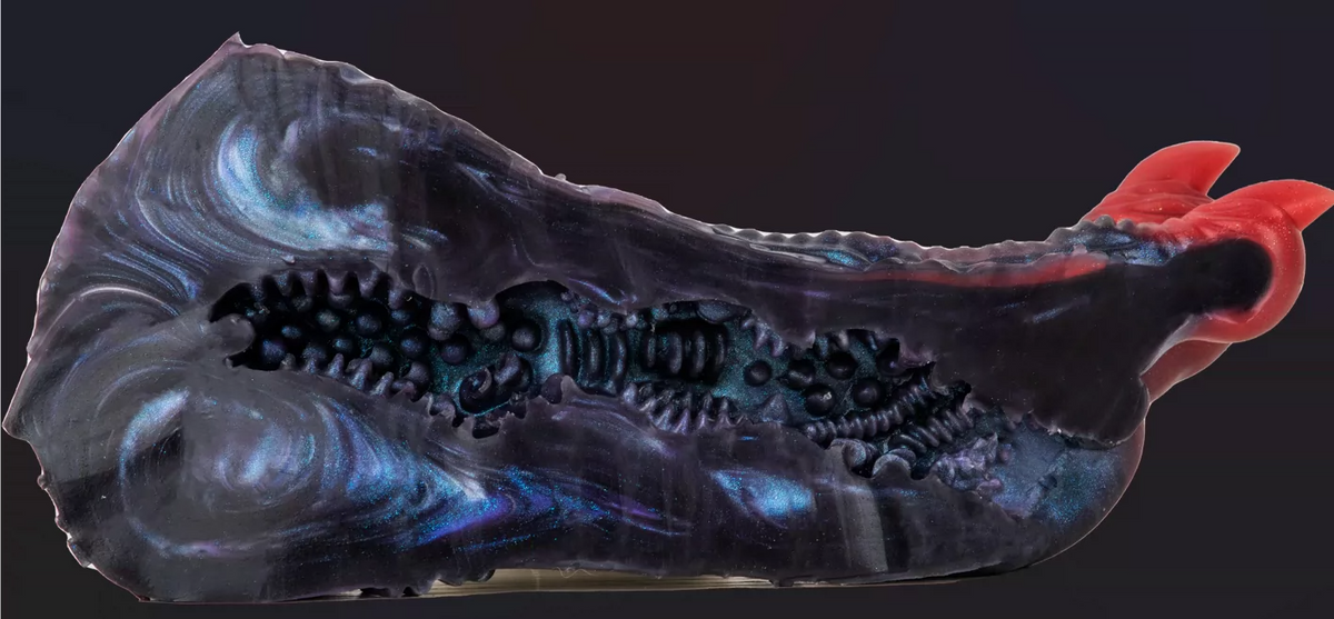 Original real-product cutaway photo showing textured interior channel of dragon claw masturbator