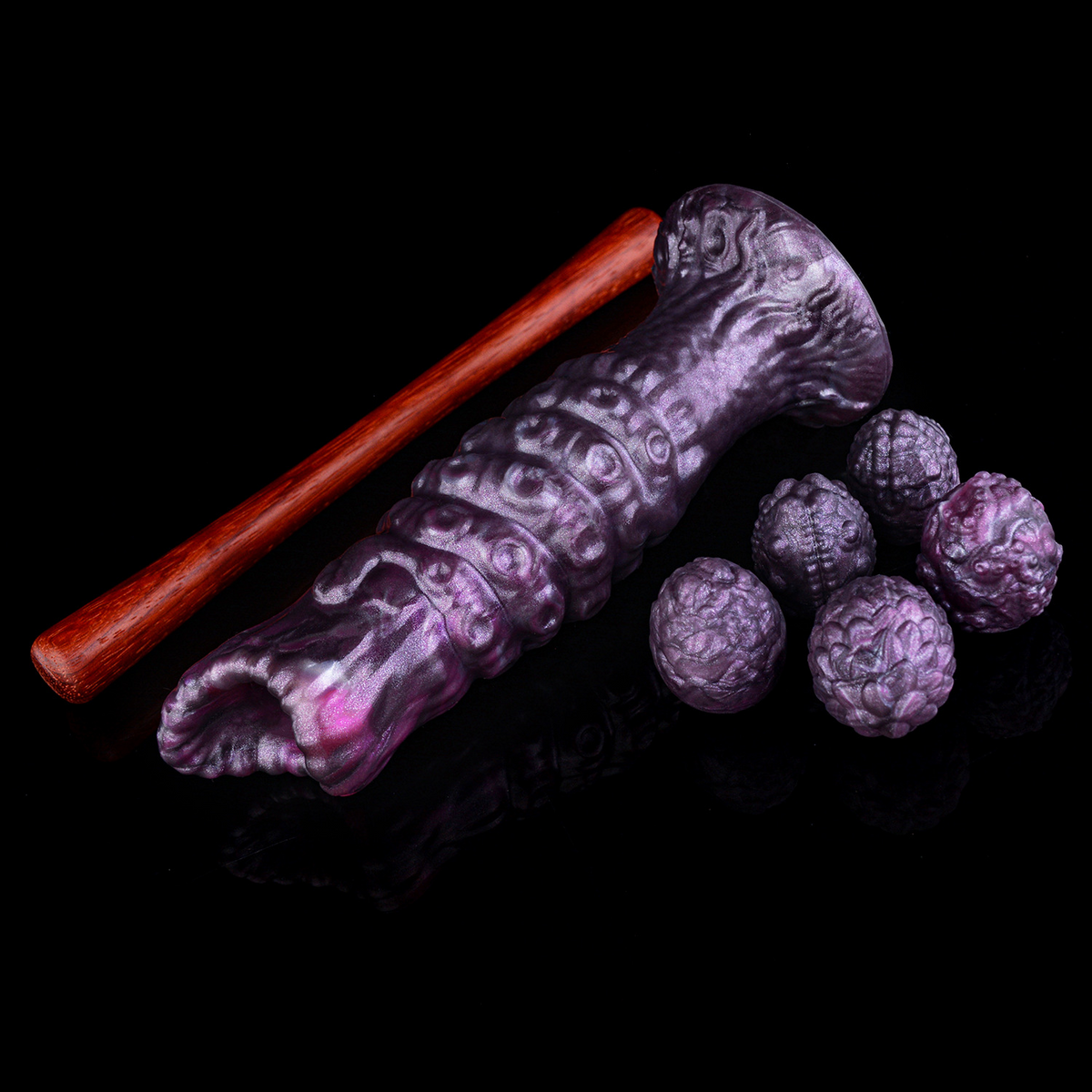 Purple fantasy ovipositor kit laid out with six textured eggs and a separate push rod