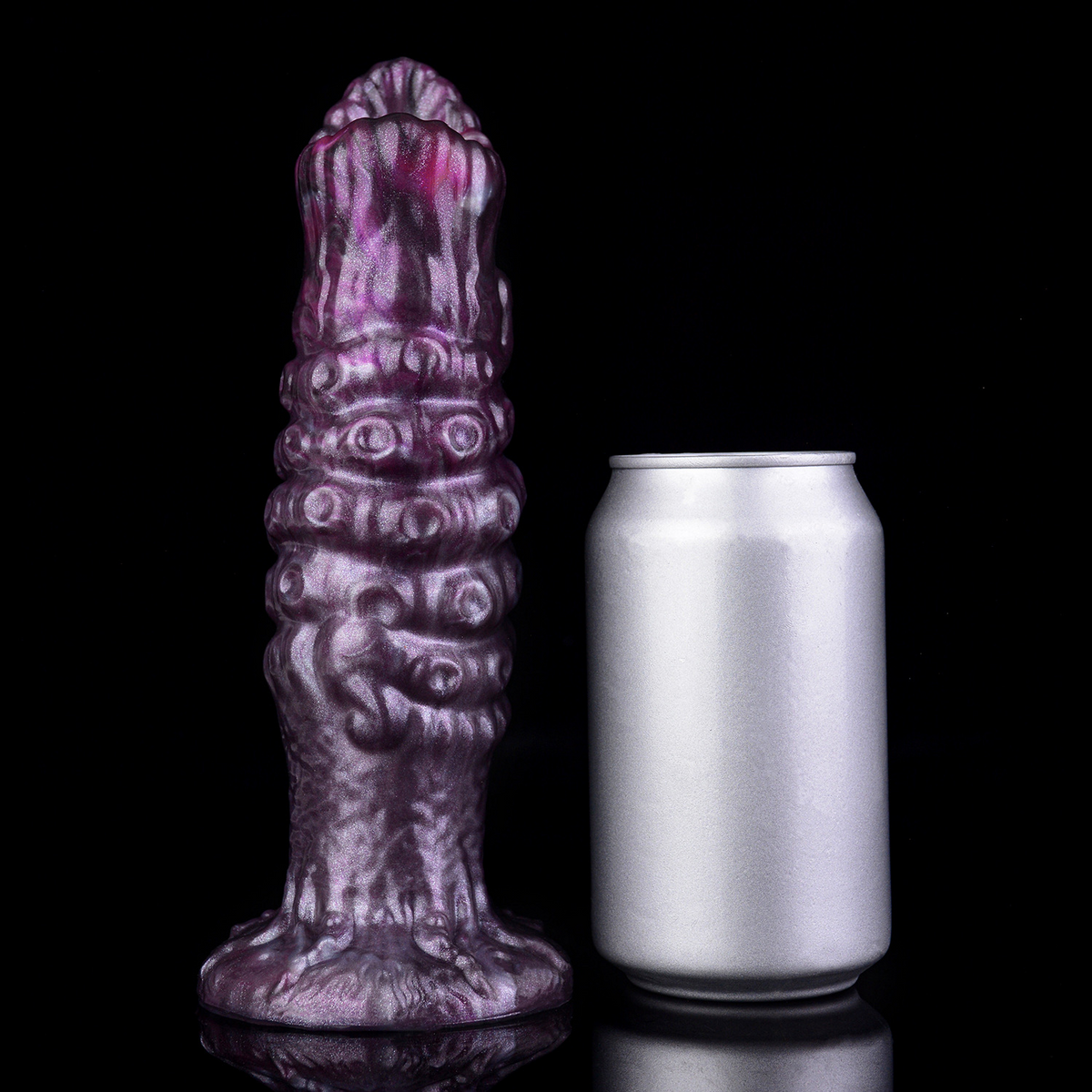Purple fantasy ovipositor photographed beside a plain silver can as a visual size comparison