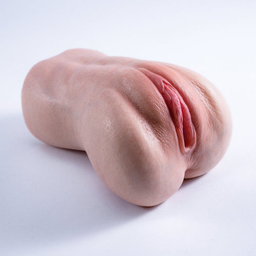 A handheld, lifelike vaginal masturbator featuring a realistic skin tone throughout, with lifelike skin texture and labia——Realistic Pocket Pussy Masturbator