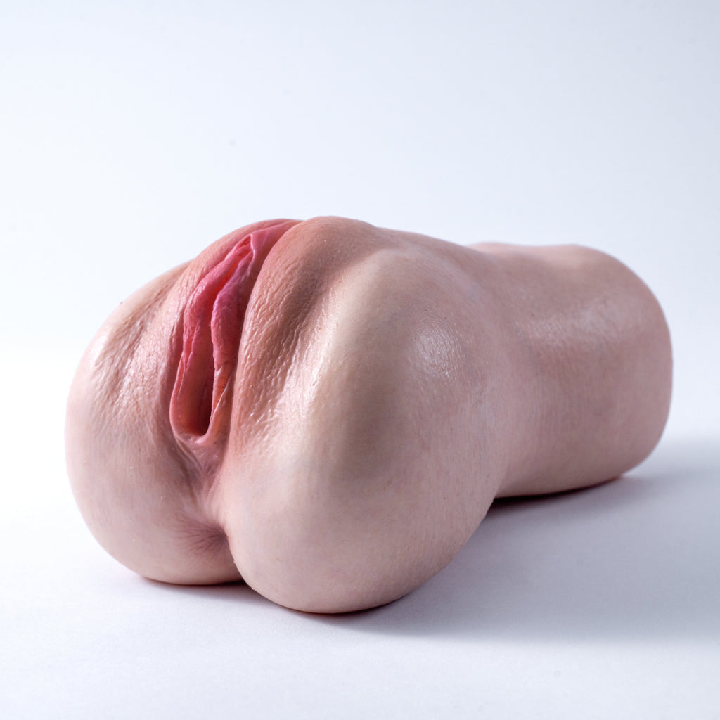 A handheld, lifelike vaginal masturbator featuring a realistic skin tone throughout, with lifelike skin texture and labia——Realistic Pocket Pussy Masturbator