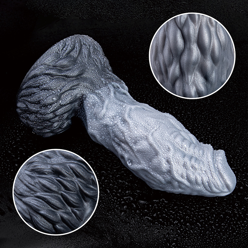 Close-up of raised organic texture on dark gray silicone fantasy dildo