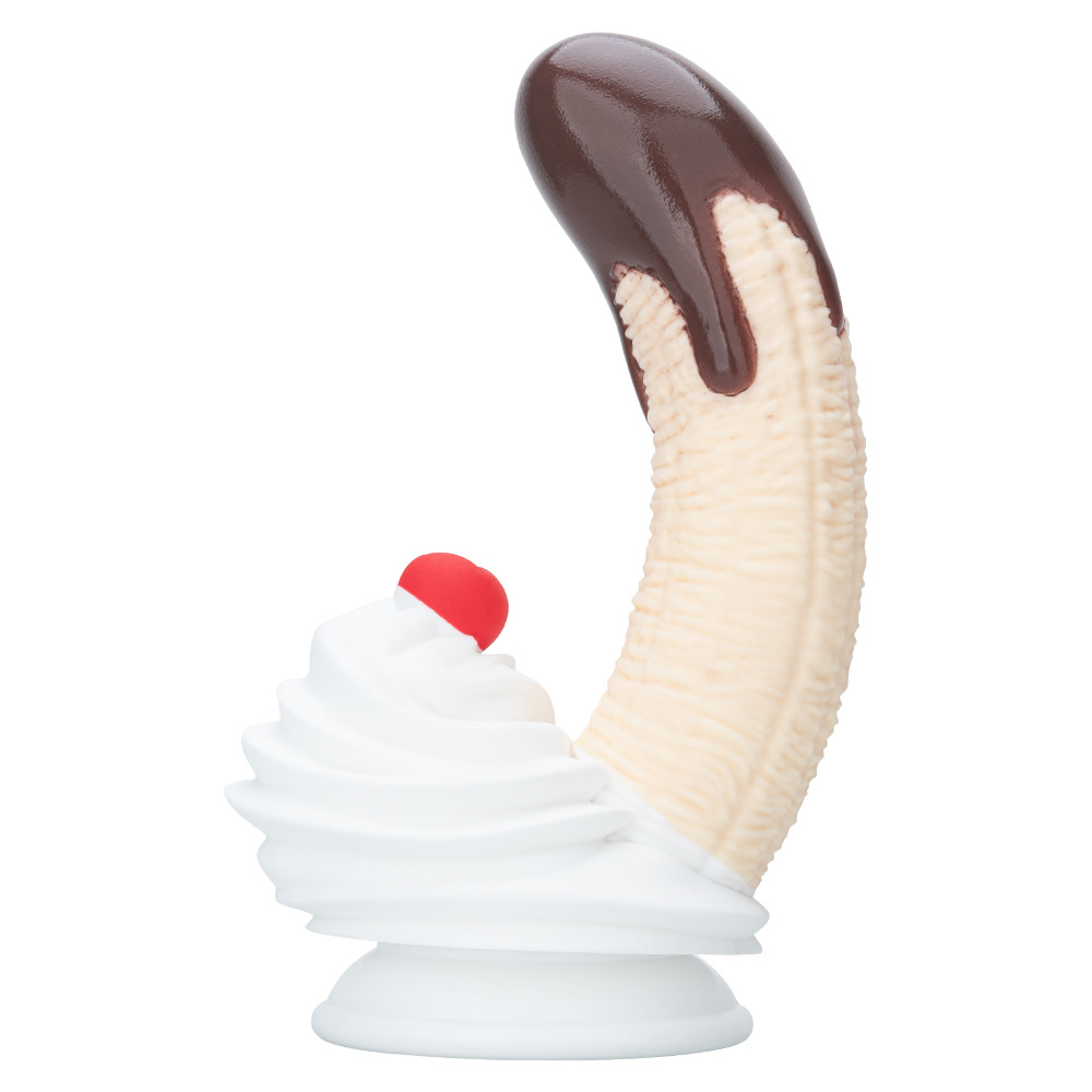 Side view of chocolate banana silicone dildo with dessert-inspired base