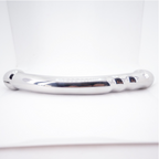 Angled close-up of the polished silver metal wand's contoured end and shaped grip section