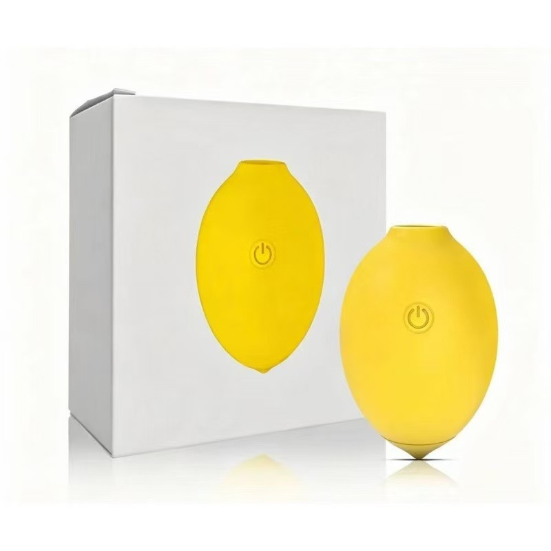 Yellow lemon-shaped suction vibrator with white retail box