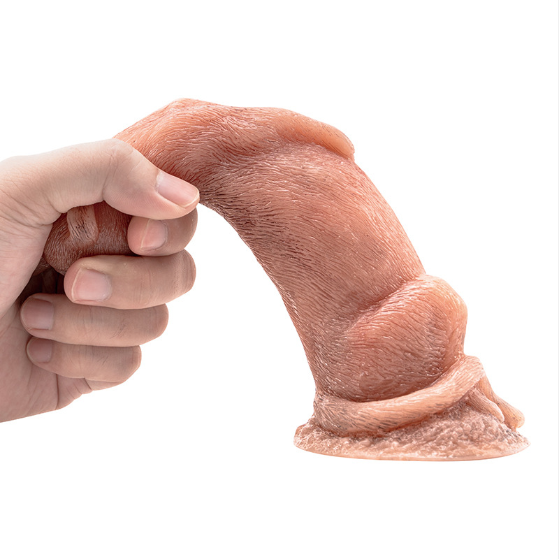 Flexible meerkat-shaped silicone fantasy dildo bent by hand