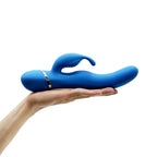 Blue silicone rabbit vibrator side profile resting on hand