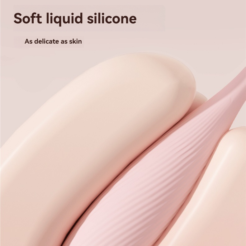 Close-up of the soft pink liquid silicone surface of the mini vibrator.