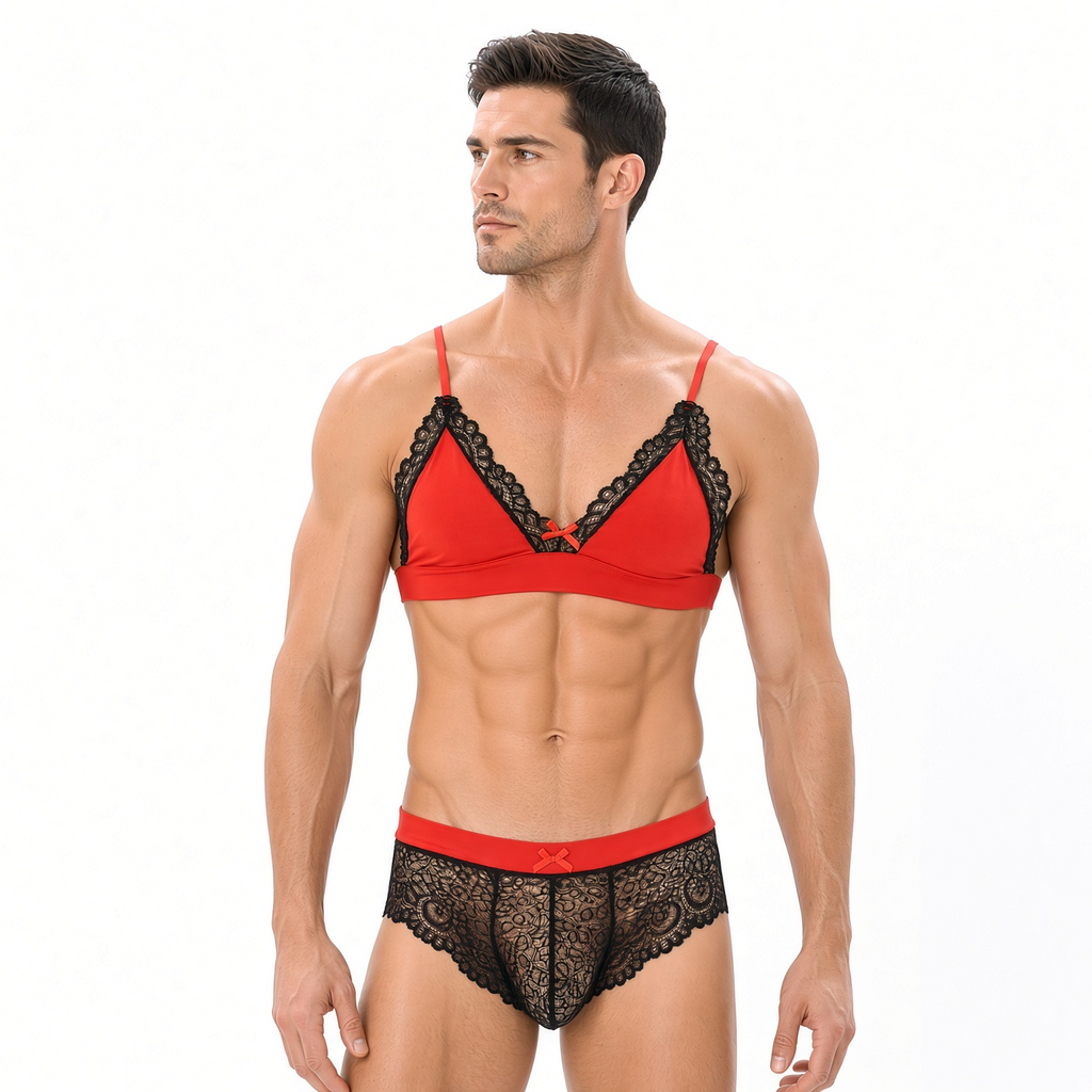 Male model wearing black and red lace bralette and matching lace brief
