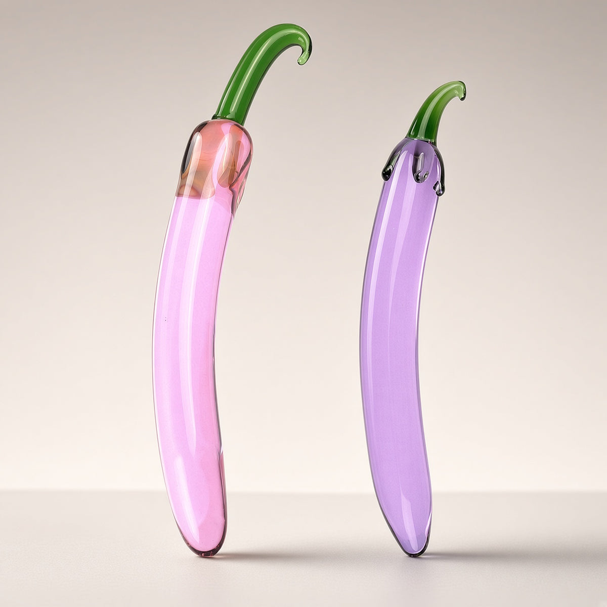 Pink shorter and purple longer eggplant borosilicate glass dildo comparison