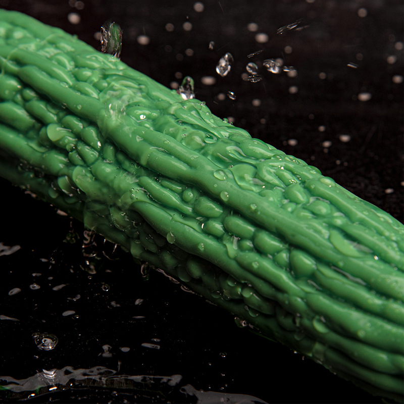 Water droplets highlighting the raised bitter melon texture