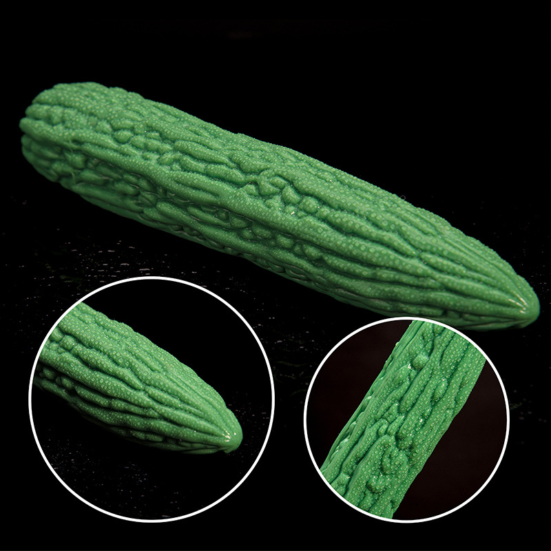 Close-up of raised bitter melon texture on a green silicone dildo