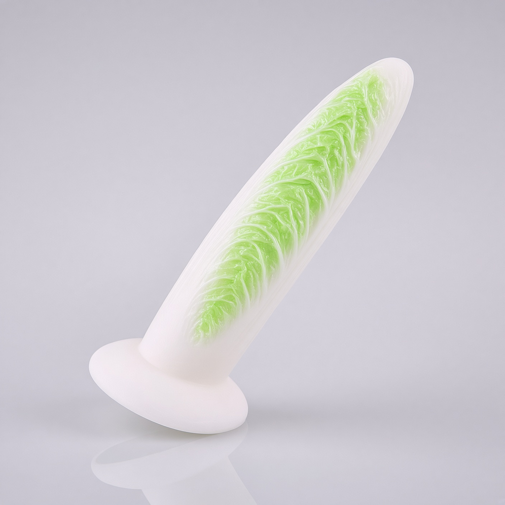 Cabbage-texture silicone dildo with wide suction cup base on a clean light background