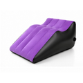 Purple and black inflatable positioning wedge pillow on a clean white background