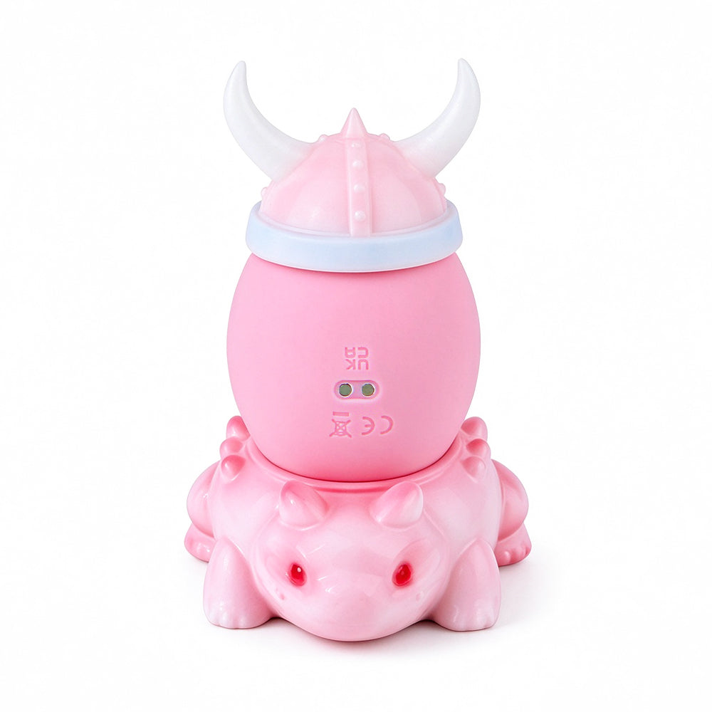 Pastel pink dragon-inspired massager assembled on original white background