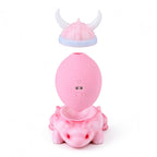 Pastel pink massager removable parts on original white background