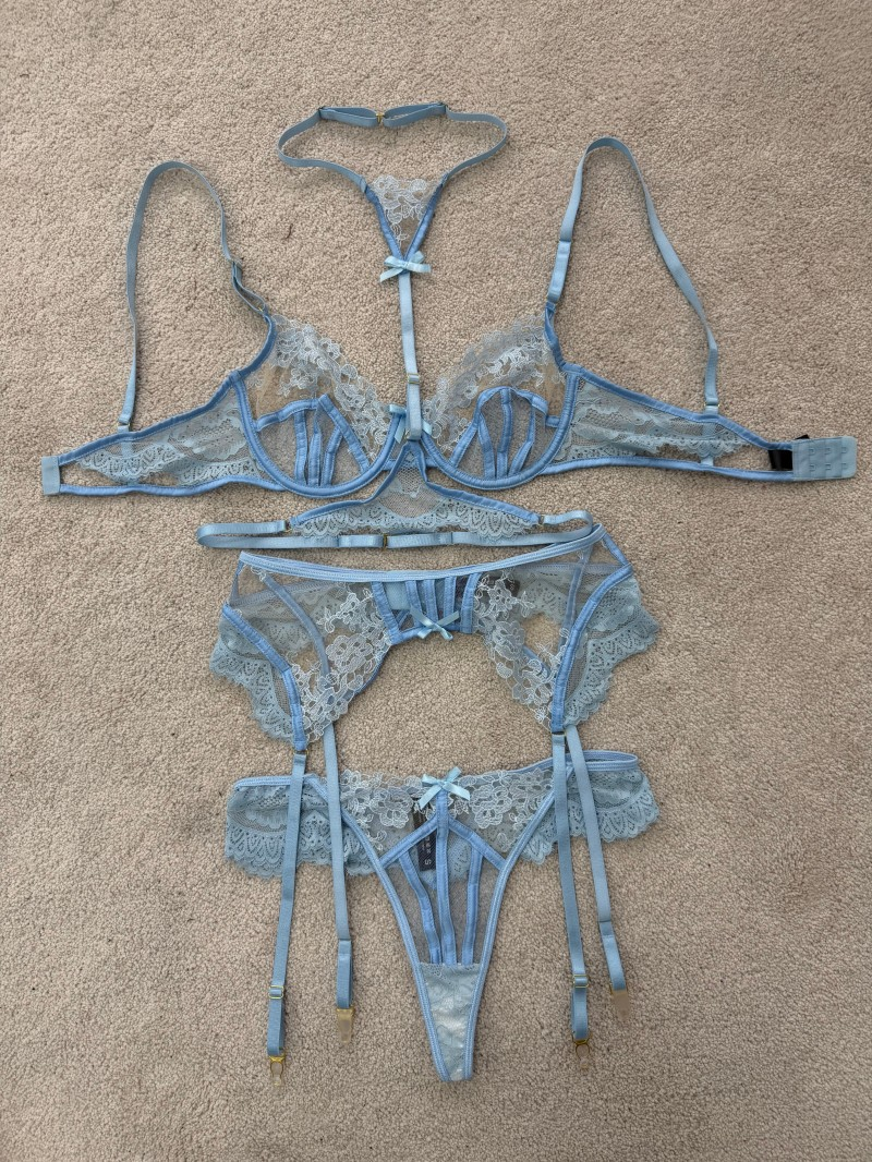 Complete light blue floral lace lingerie set with bra, garter belt, thong and matching thigh garters