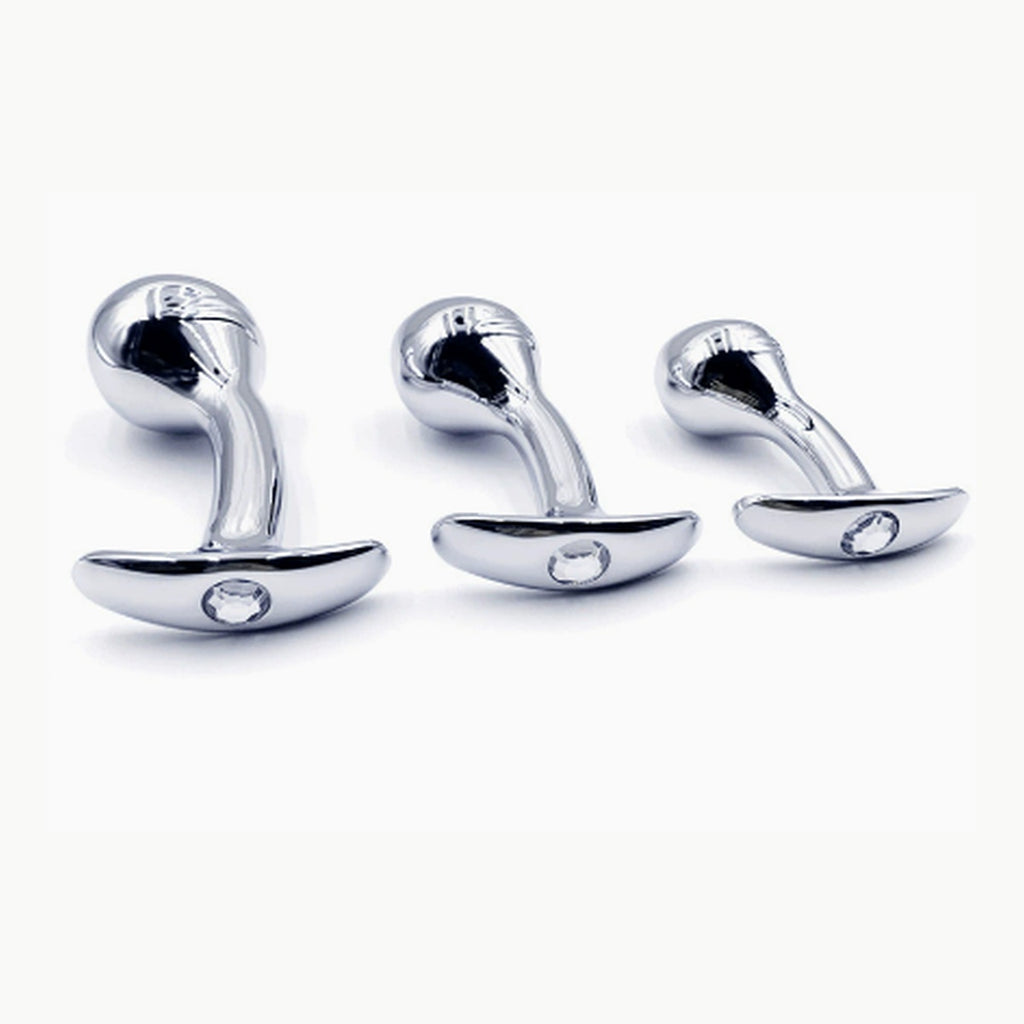 Three sizes of silver curved aluminum anal plugs with clear faceted jeweled bases