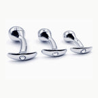 Three sizes of silver curved aluminum anal plugs with clear faceted jeweled bases