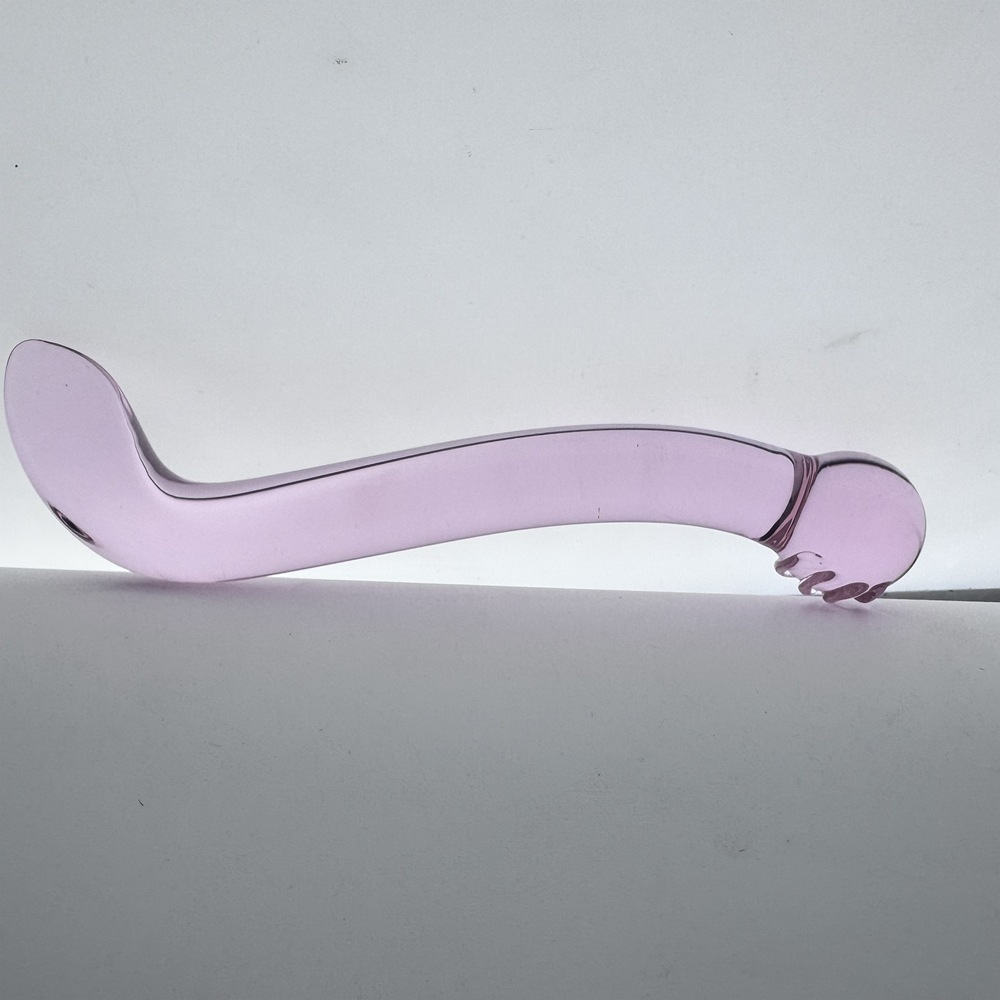 Side view of curved double-ended purple glass dildo