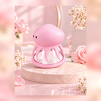 Pink Jellyfish suction and licking nipple massager on a floral studio background