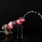 N5092 marbled silicone squirting dildo demonstrating manual liquid release from the tip