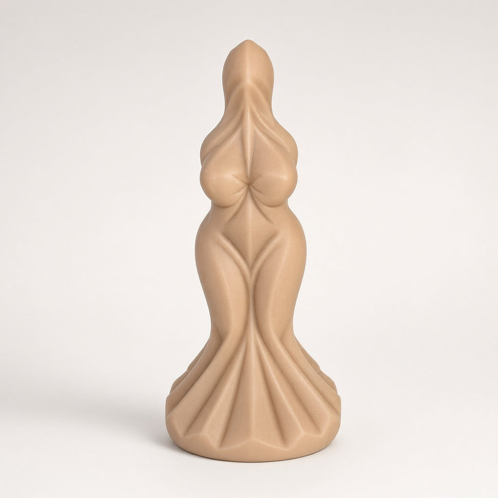 Skin Tone sculpted goddess-form curved silicone dildo on a clean light background