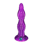 Purple sculpted fantasy dildo front view with layered texture and suction base